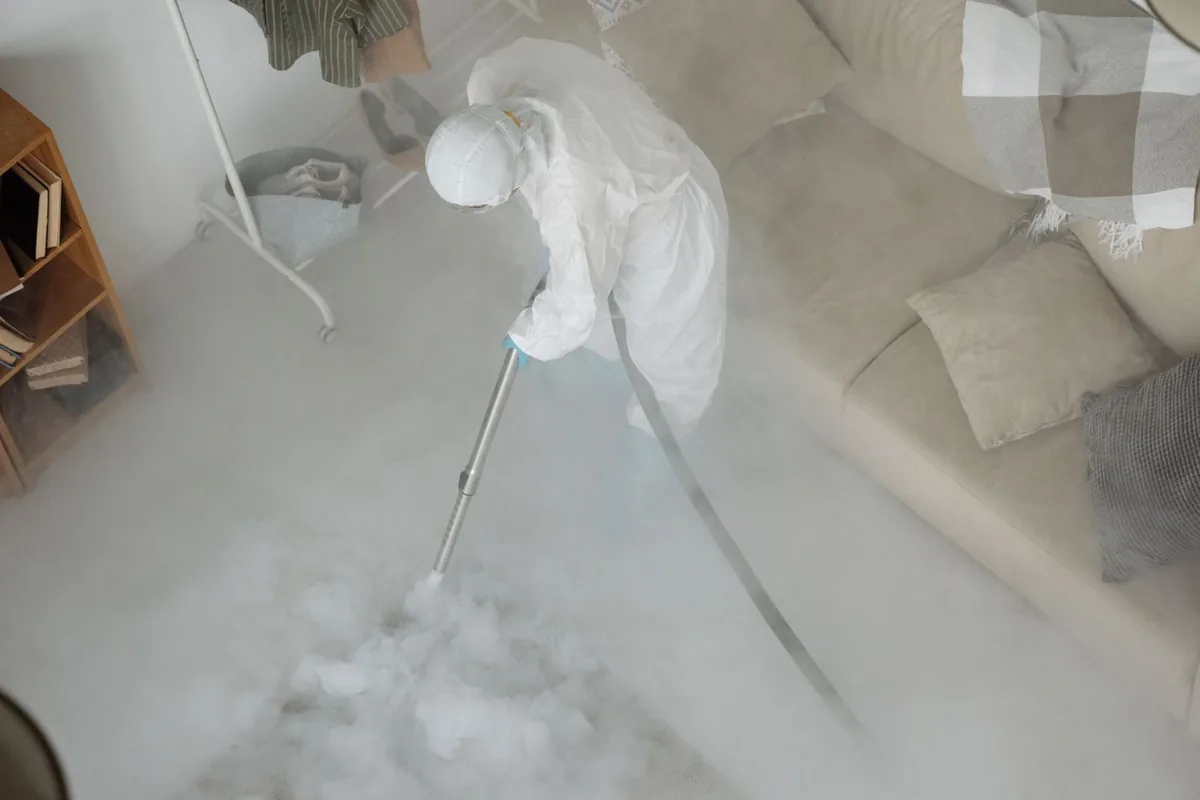 Biohazard cleanup technician in protective equipment, Downtown, Orlando, FL